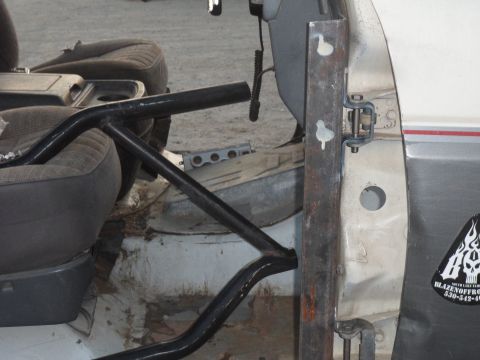 1991 Ford Bronco - Custom roll cage fabrication in progress inside a vehicle's cabin.