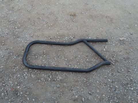 1991 Ford Bronco - A black metal door bar is shown lying on a gravel surface. The registry claims it is from a 1991 Ford Bronco, but this is unconfirmed.