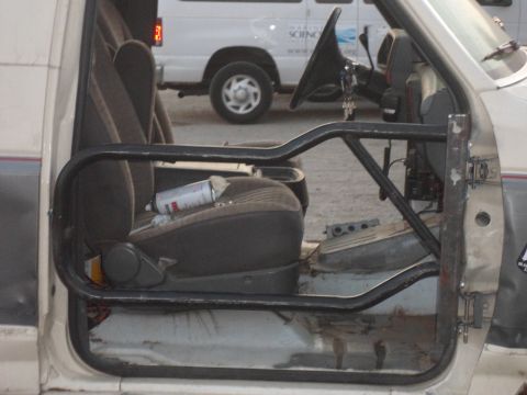 1991 Ford Bronco - Interior view of a 1991 Ford Bronco, modified with a roll cage.