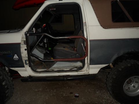 1991 Ford Bronco - Interior view of a 1991 Ford Bronco with a custom roll cage installed.