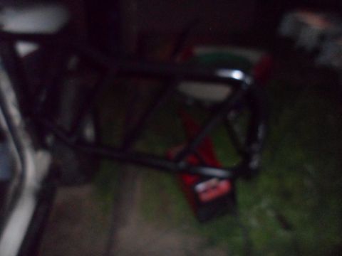 1991 Ford Bronco - A black roll cage with red accents is visible in the frame.