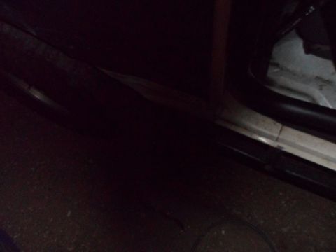 1991 Ford Bronco - Interior view of a vehicle's door sill area, showing trim and seals.