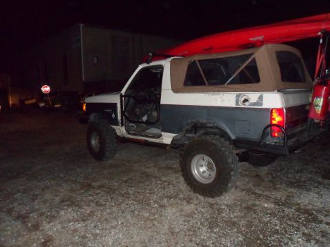 1991 Ford Bronco - This two-tone Ford Bronco is equipped for adventure, with a kayak secured to its roof.