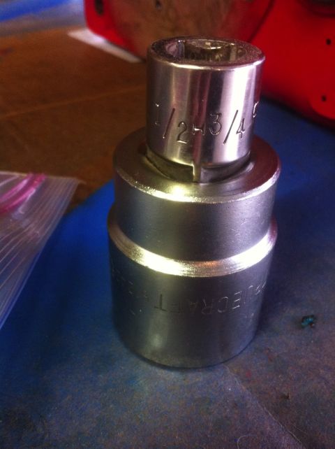 1989 Ford Bronco - Close-up of a socket adapter showing size markings and brand name.