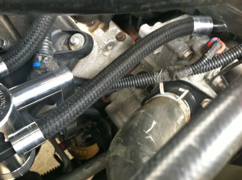 2010 Dodge 1500 - A detailed view of engine bay components, including hoses and mechanical parts.