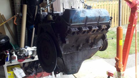 1978 Ford Bronco - Engine removed from vehicle for rebuild, with parts and tools visible in the background.