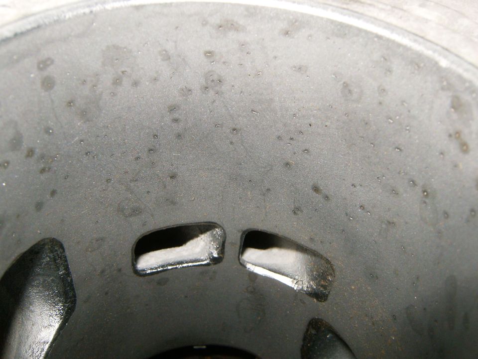 Engine cylinder interior with oil residue and two ports visible