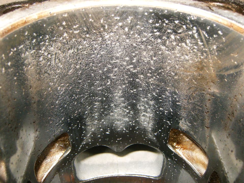Close-up of a cylinder wall showing significant scoring and debris