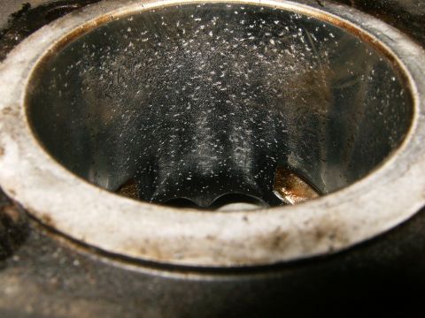 2000 Ford E350 - This is a close-up view of an engine cylinder, showing internal wear and residue.