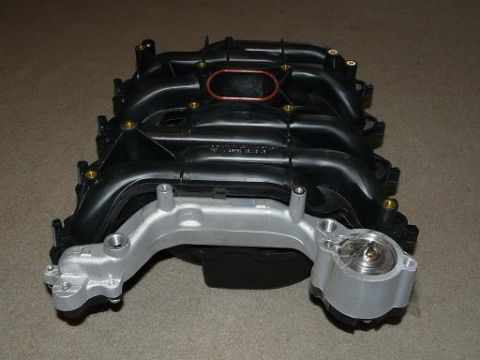 1999 Ford Crown Victoria - Engine intake manifold part shown from an angled perspective on a neutral background.