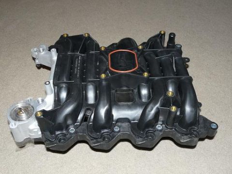 1999 Ford Crown Victoria - This is a Ford intake manifold, likely for a V8 engine, with part numbers visible.