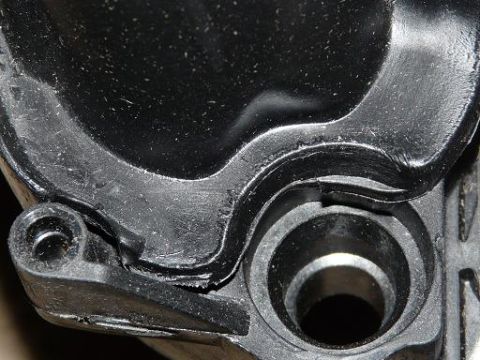 1999 Ford Crown Victoria - Close-up of a black plastic intake manifold part, showing wear and a Supermotors.net watermark.