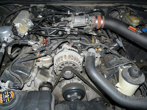 1999 Ford Crown Victoria engine bay with K&N intake and visible alternator