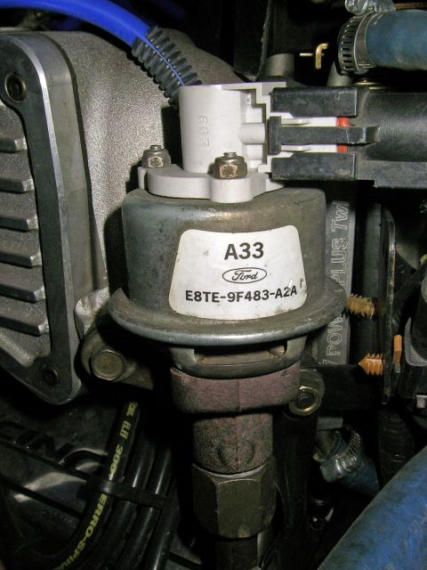 1990 Ford Bronco - Close-up of a Ford emissions control valve, identified by the A33 label and part number E8TE-9F483-A2A.
