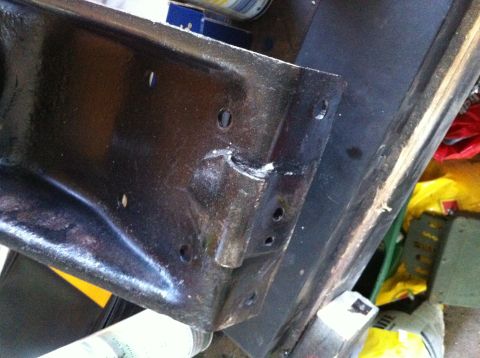 1996 Ford Bronco - A close-up view of a vehicle's frame, showing its construction and mounting points.