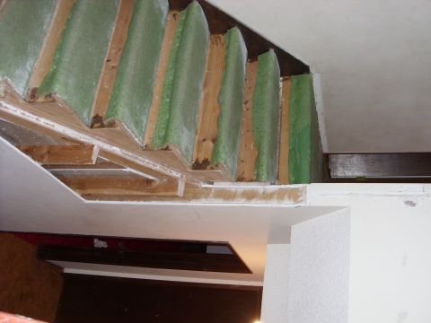 1988 Ford Bronco - Construction in progress reveals green insulation panels and wooden structural elements.