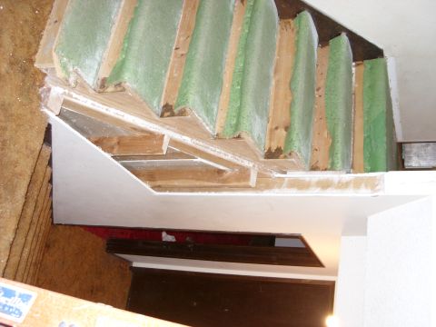 1988 Ford Bronco - Construction progress on a staircase, showing framing and insulation materials.