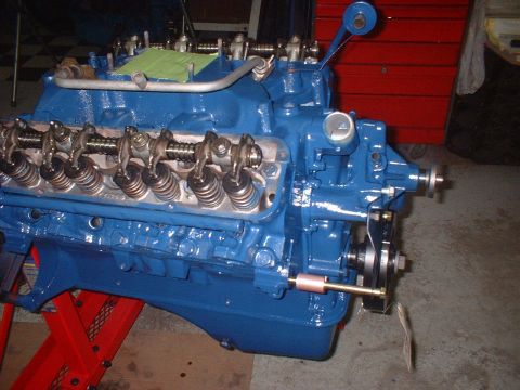 1969 Mercury Cyclone - Close-up of a blue V8 engine with visible valve train components and accessory drive pulleys.