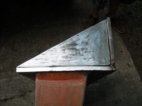 1979 Ford F-150 - A close-up view of a metal component mounted on an orange support structure.