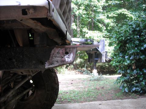 1979 Ford F-150 - Close-up of a truck's front frame and bumper, showing signs of wear and modification.