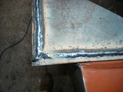 1979 Ford F-150 - Metal corner showing fresh welding work with visible slag and porosity.