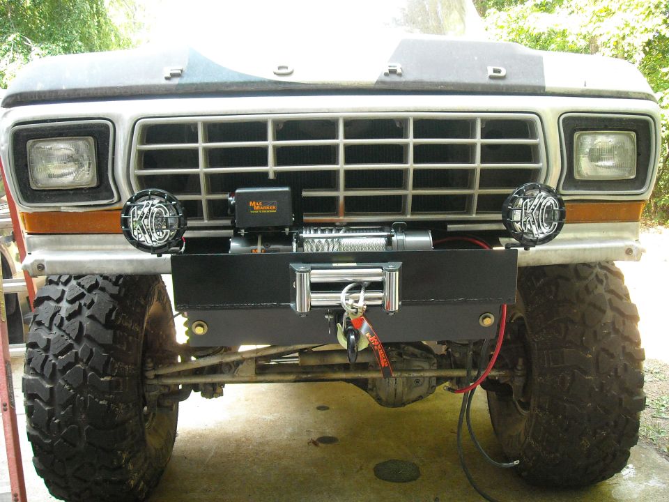 Front view of a 1979 Ford F-150 with a winch and KC lights mounted on the aftermarket bumper