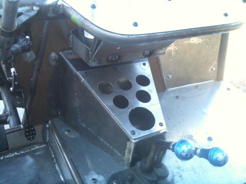 1966 Ford Bronco - Interior view of a custom buggy, a fabricated metal console with multiple circular cutouts and two blue shift knobs.