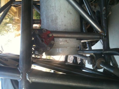 1966 Ford Bronco - Close-up view of a custom buggy's internal structure, including a fuel tank and roll cage.
