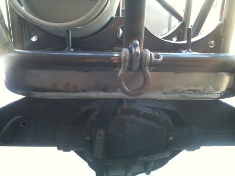 1966 Ford Bronco - Close-up view of an off-road buggy's frame, a shackle and differential. Text '1/4 BEARD' is visible on the differential cover.