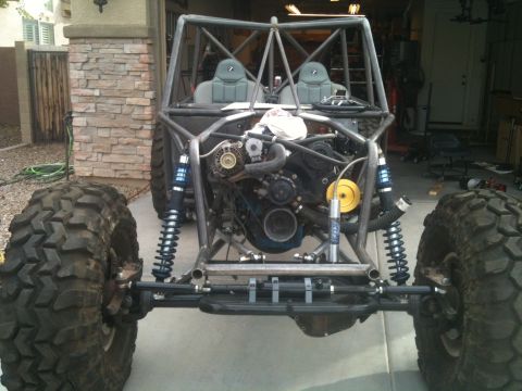 1966 Ford Bronco - This custom-built buggy features a roll cage, exposed engine, and massive off-road tires, suggesting it's designed for extreme terrain.
