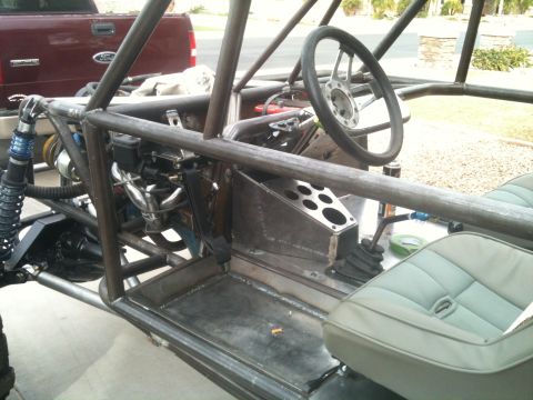 1966 Ford Bronco - Interior view of a custom-built off-road buggy, showing its roll cage and seating.
