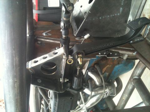 1966 Ford Bronco - This image shows the interior of a custom-built vehicle, focusing on the steering and pedal assembly.