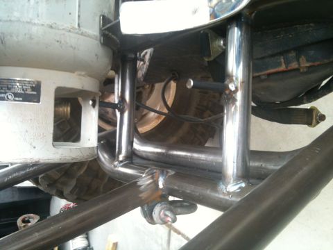 1966 Ford Bronco - Custom off-road vehicle chassis features a propane tank and visible suspension components.