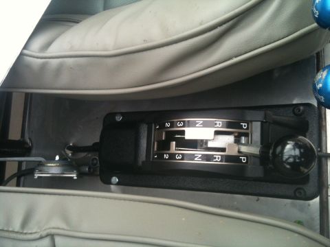 1966 Ford Bronco - Close-up of an automatic transmission shifter with gear selection indicators.