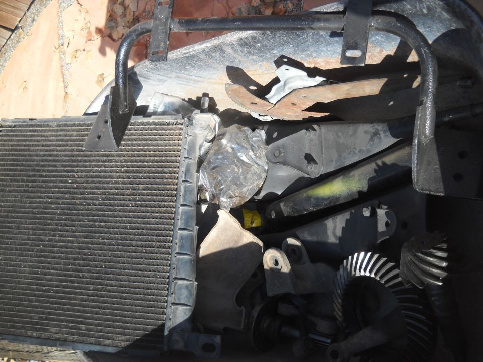 Radiator and various car parts including gears and brackets