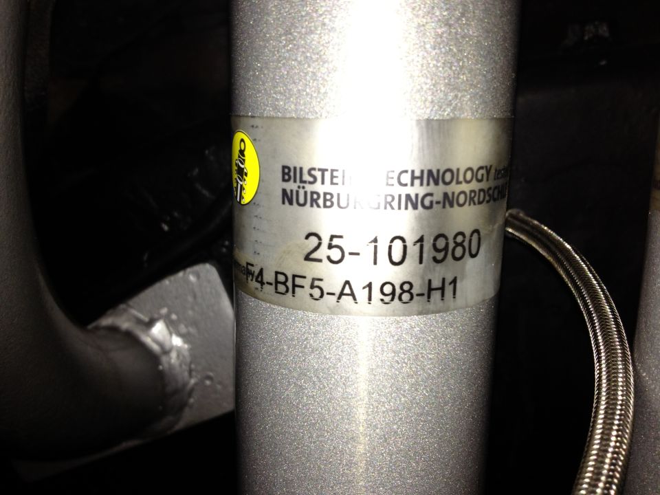 Close-up of Bilstein shock body label reading 25-101980
