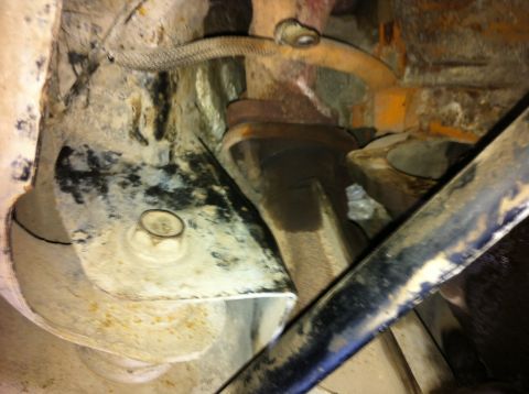 1998 Ford Crown Victoria - Underside view of a vehicle's exhaust manifold and bracket assembly.