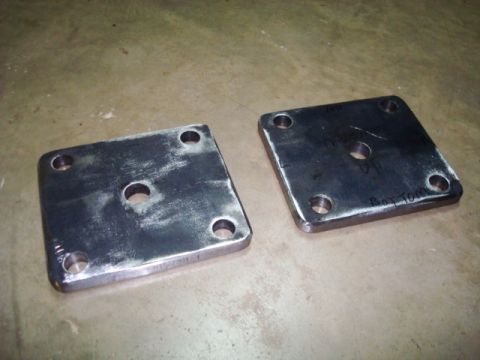 1995 Ford Bronco - Two metal plates with bolt holes are shown, one with handwritten text indicating its orientation.