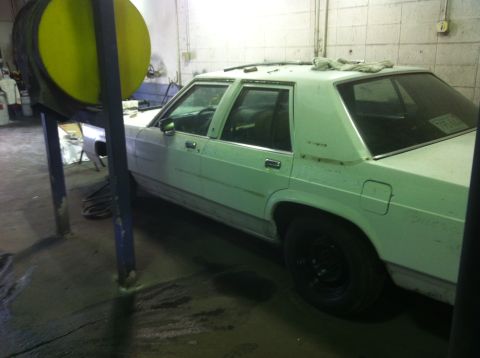 1991 Ford LTD Crown Victoria - White 1991 Ford Crown Victoria LTD parked inside a garage.