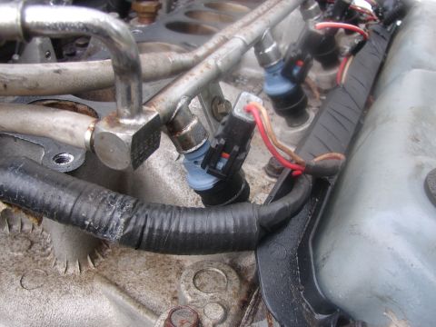 1973 Ford Ranchero - Close-up view of engine fuel injectors and associated fuel rail and wiring.