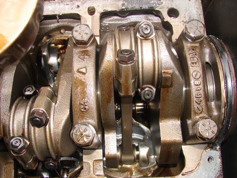 1973 Ford Ranchero - Close-up view of engine crankshaft and connecting rods, showing internal mechanical components.