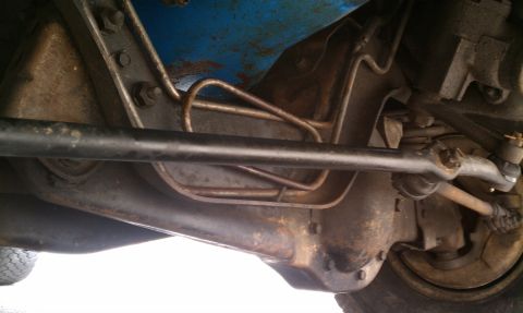 1984 Ford Bronco - It appears that this tie rod (I think its the steering arm) has been replaced. No sway bar at all.