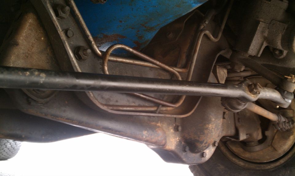 It appears that this tie rod (I think its the steering arm) has been replaced.  No sway bar at all.