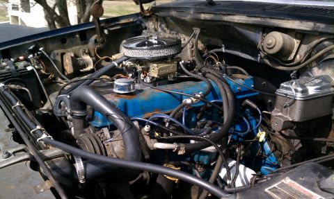 1984 Ford Bronco - Engine bay details, including blue valve covers and a chrome air cleaner assembly.