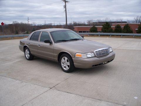 2007 Ford Crown Victoria - A 2007 Ford Crown Victoria is seen from a 3/4 front angle on a cloudy day.