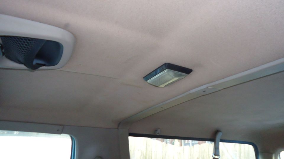 Interior ceiling view showing an air vent and a dome light