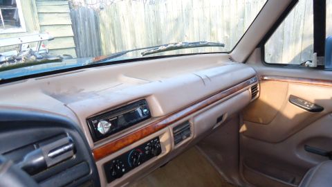 1996 Ford Bronco - Interior view of a 1996 Ford Bronco, highlighting the dashboard and center console.