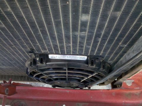 1979 Ford Bronco - Close-up view of an electric fan installed on a vehicle's radiator, showing the Hayden brand label.