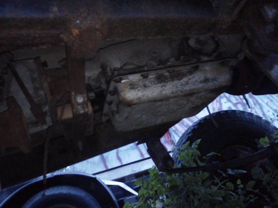Underside view of vehicle transmission and tire