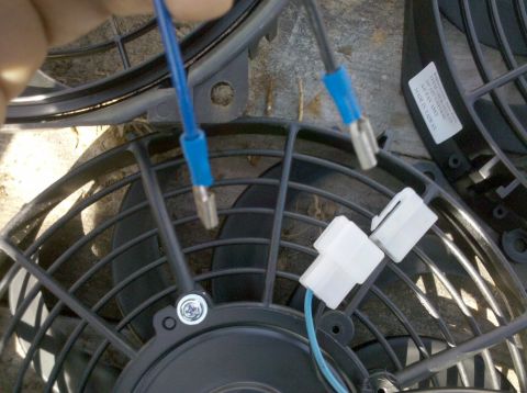 1979 Ford Bronco - Close-up of electric fans and their wiring harnesses, likely for an automotive installation.